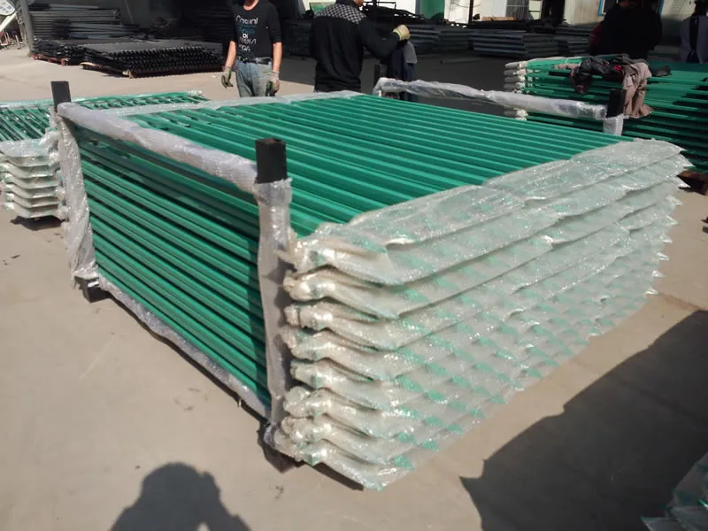 Green spear top tubular fence panels, 2400 x 1800 mm